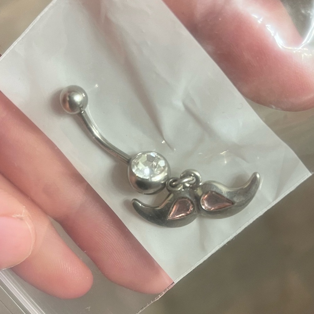 Mustache belly button piercing